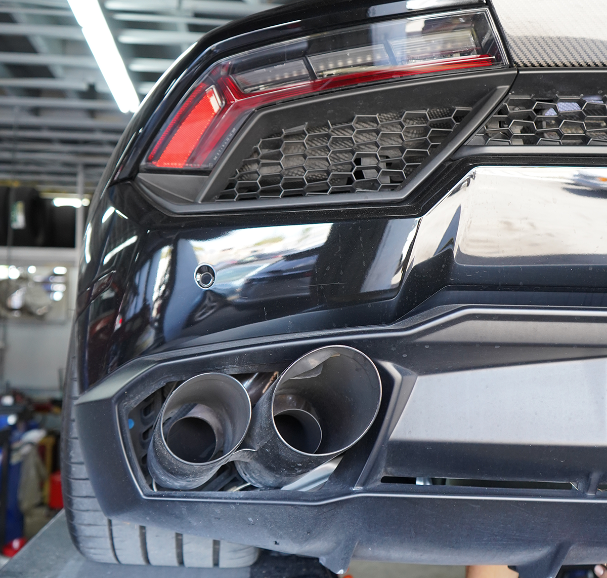 Exotic performance vehicle in a service workshop