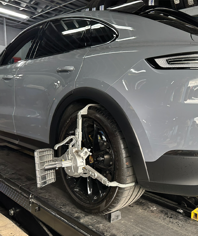 Wheel alignment service on a vehicle