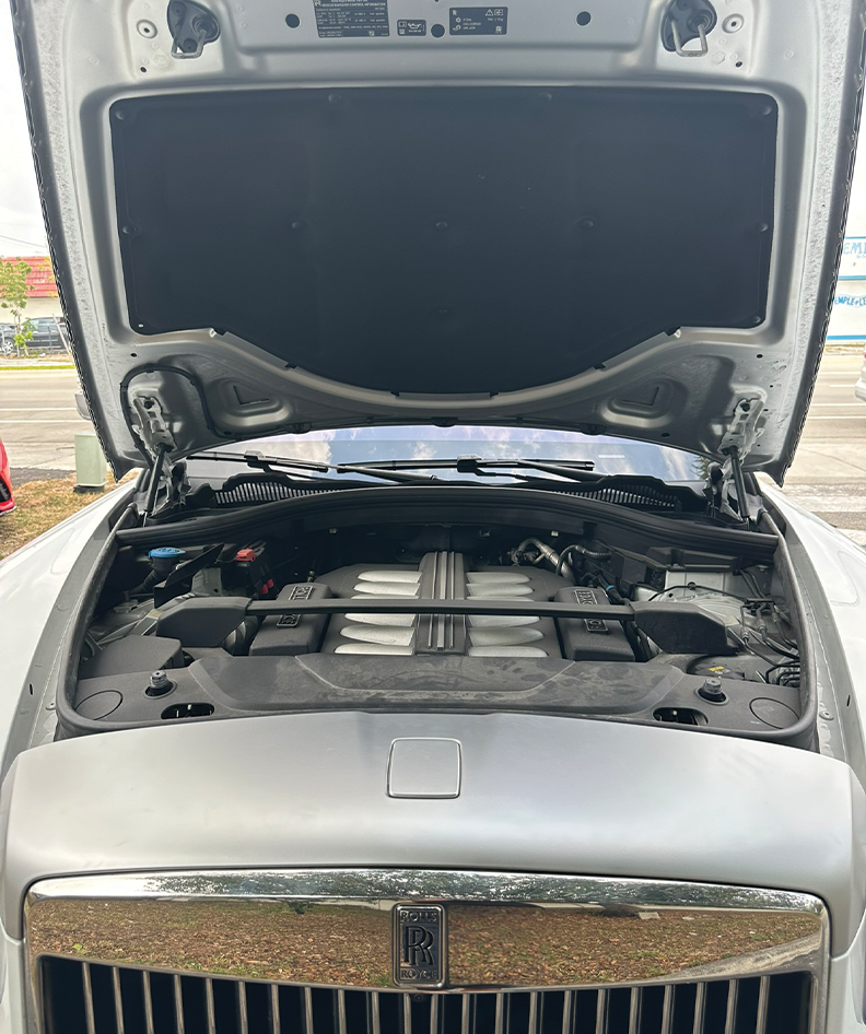 Luxury vehicle receiving detailed care in a workshop